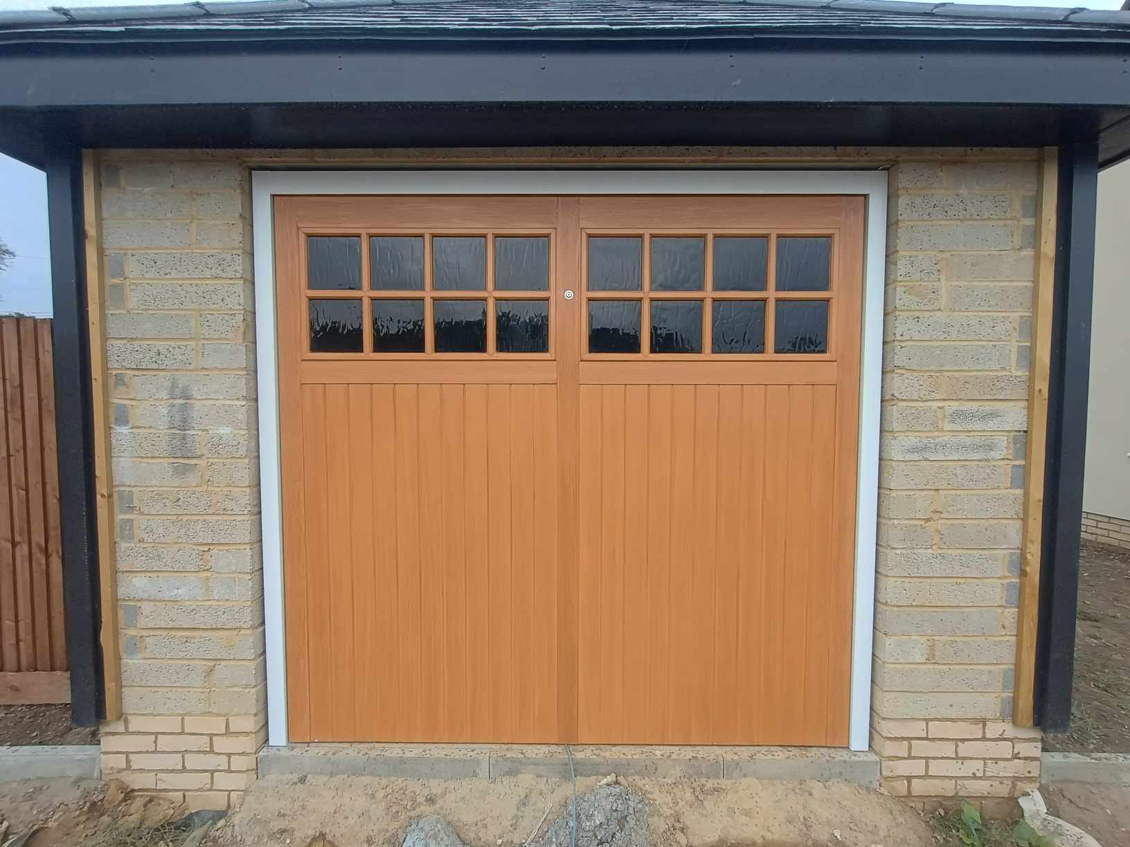 Chertsey GRP Up and Over Light Oak Black Glazing