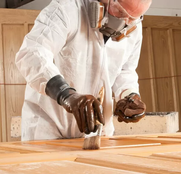 Person laminating the wooden door