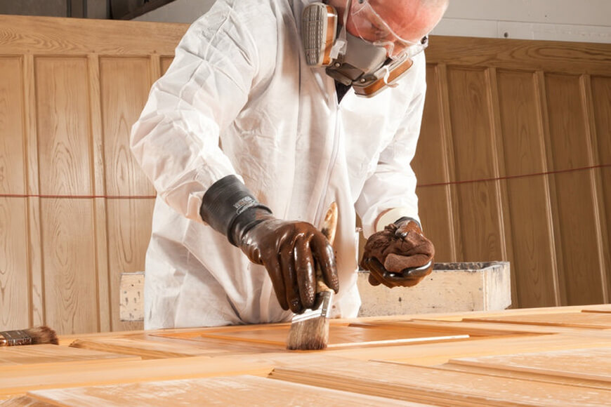 Person laminating the wooden door
