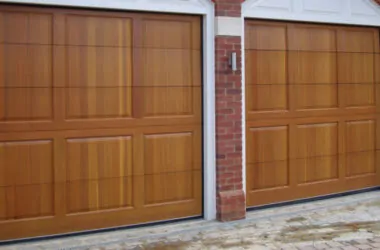 Pair of timber garage doors with rectangular panel detailing.